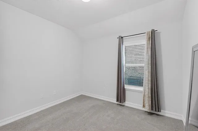 a work room with furniture and a flat screen tv