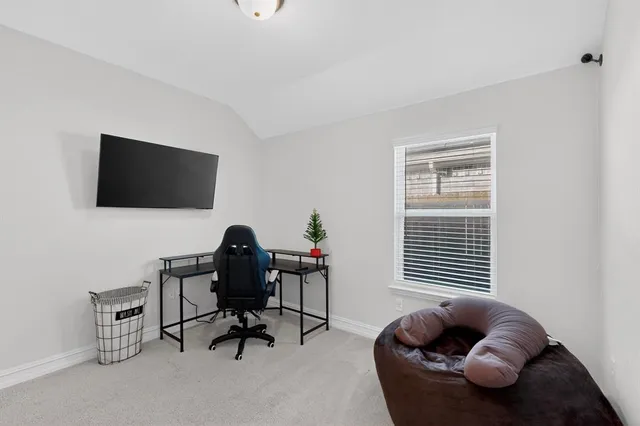 a view of a chair and table in a room