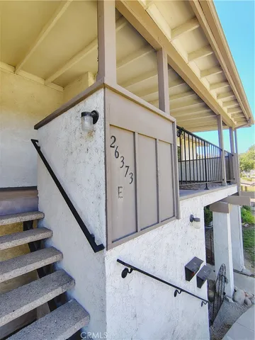 a view of entryway with wooden floor and door