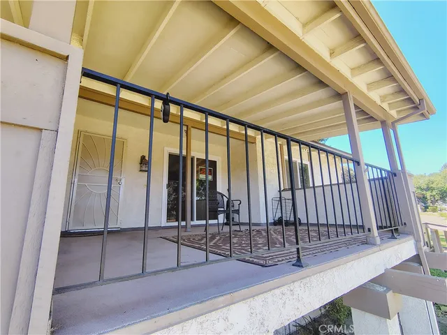a view of a porch and wooden floor