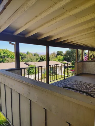 a aerial view of a house with a yard table and chairs