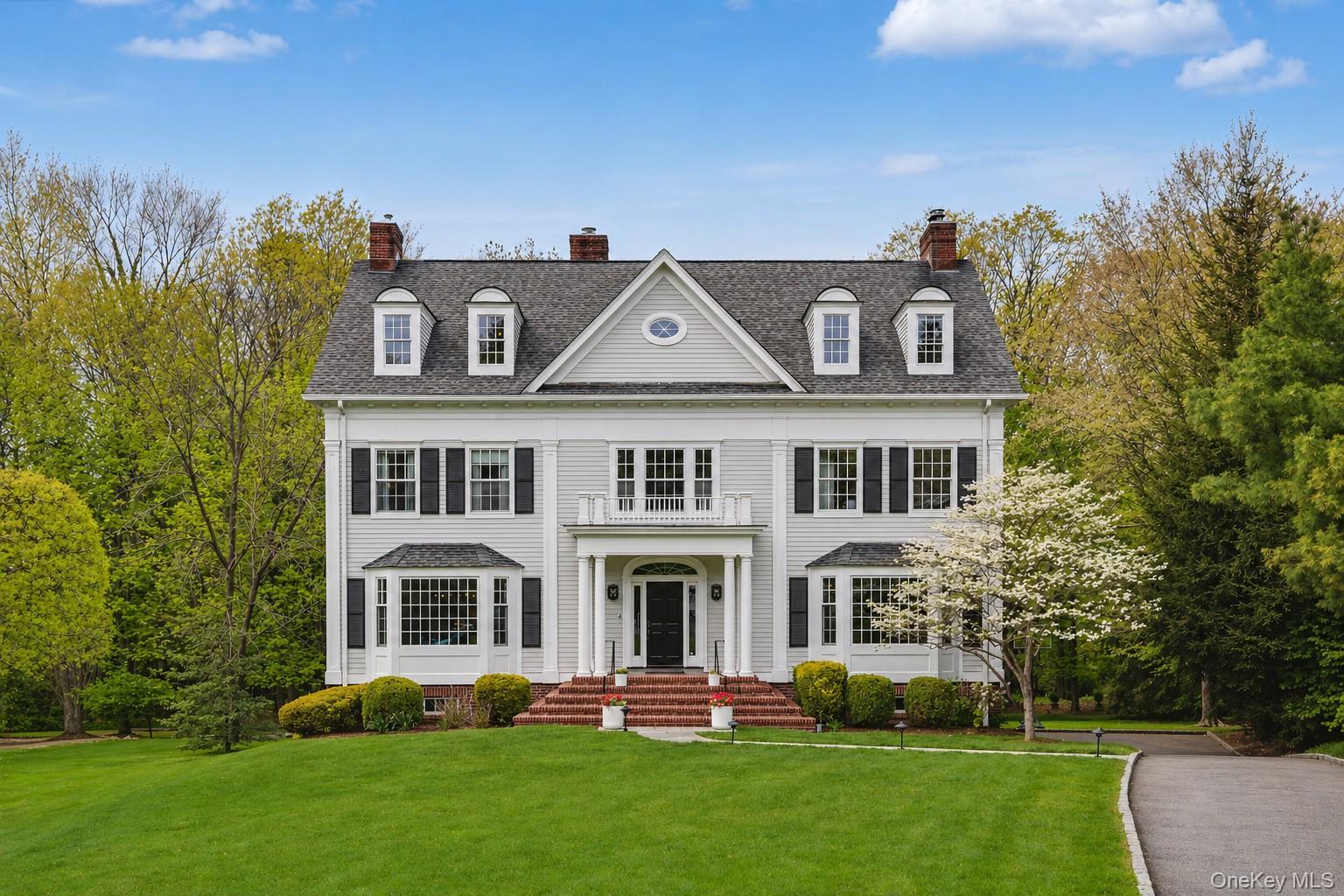 Gleaming colonial at the end of a private Rye cul-de-sac with serene park like backyard and a convenient to all location