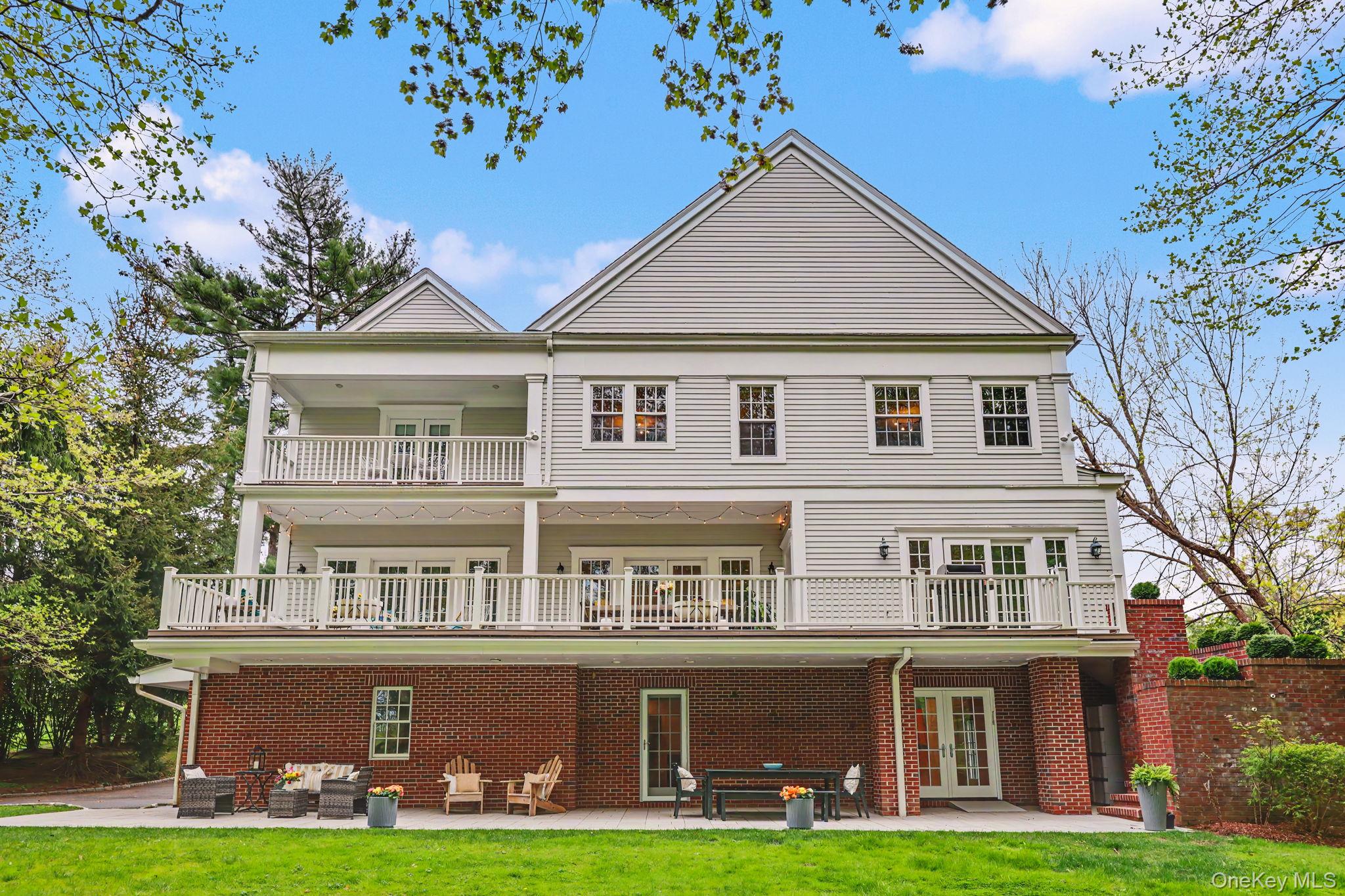 10 Morris Court Rye, NY 10580 - Photo 2 of 44 Enjoy unmatched backyard privacy, with park-like views from your deck, patio and primary bedroom balcony.