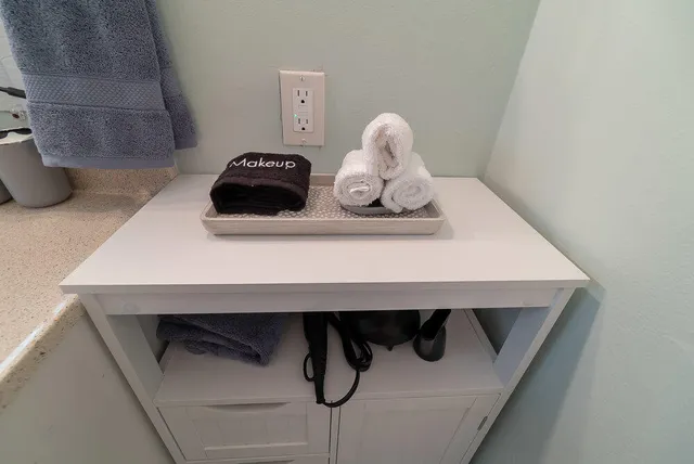 a bedroom with a bed and a dresser in it