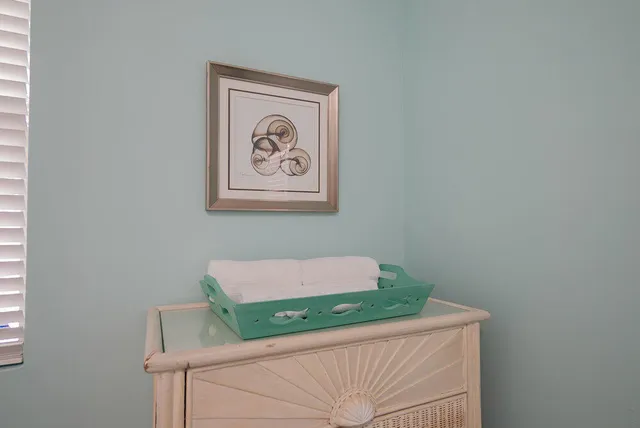 a living room with furniture a window and a dining table