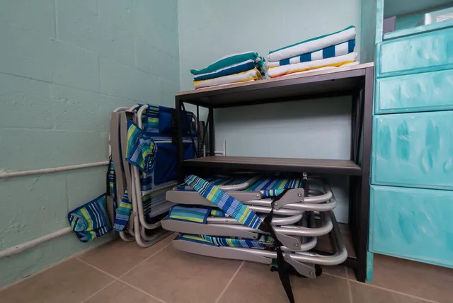 a living room with furniture a rug and a window