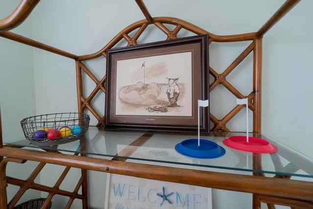a view of a patio with a table chairs and a backyard
