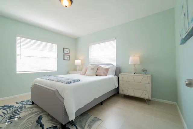 a bedroom with bed and window