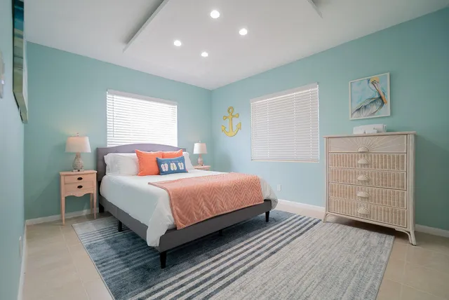 a bedroom with a bed and a dresser