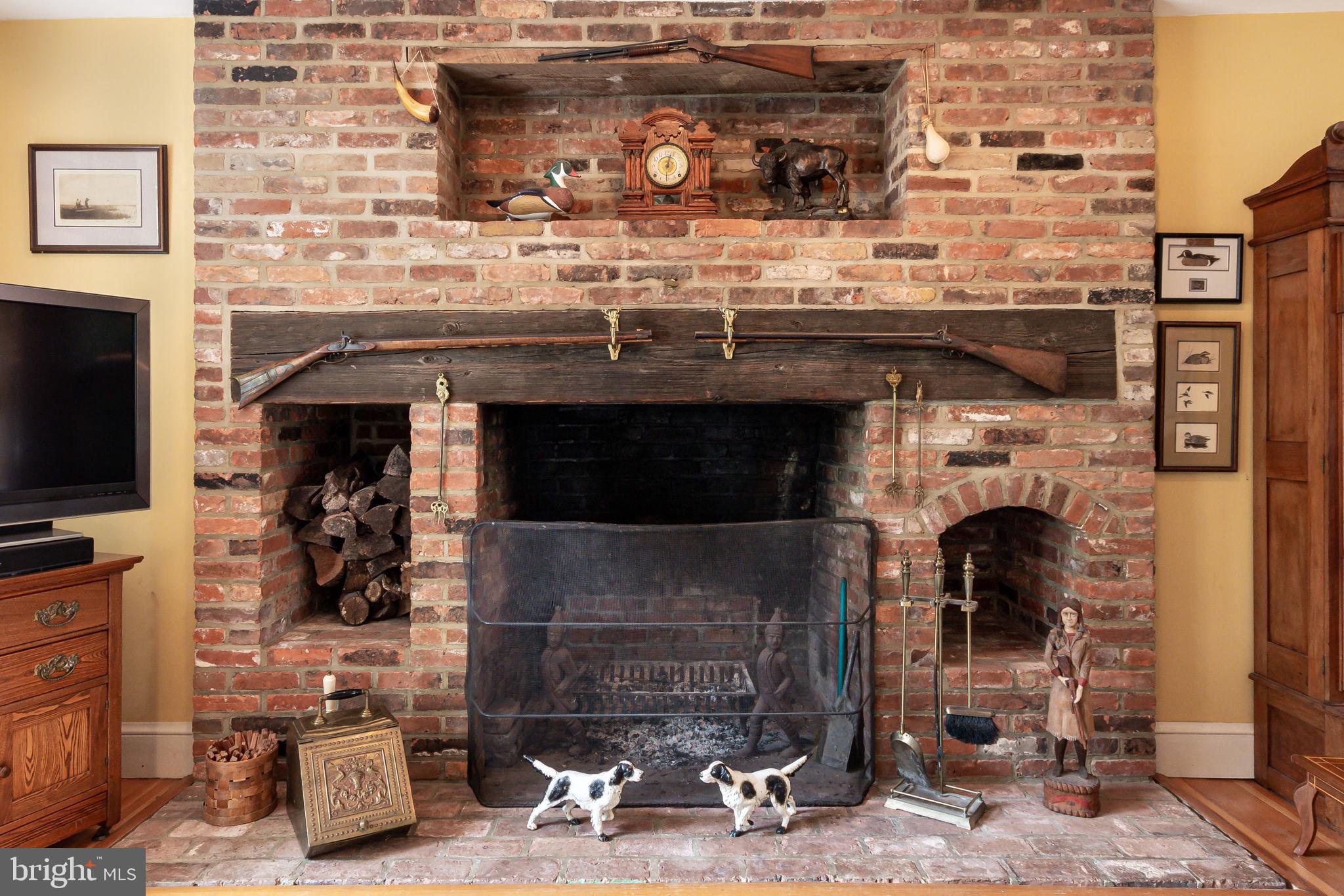 5338 Sudley Road West River, MD 20778 - Photo 22 of 57 Wide brick fireplace with built-ins