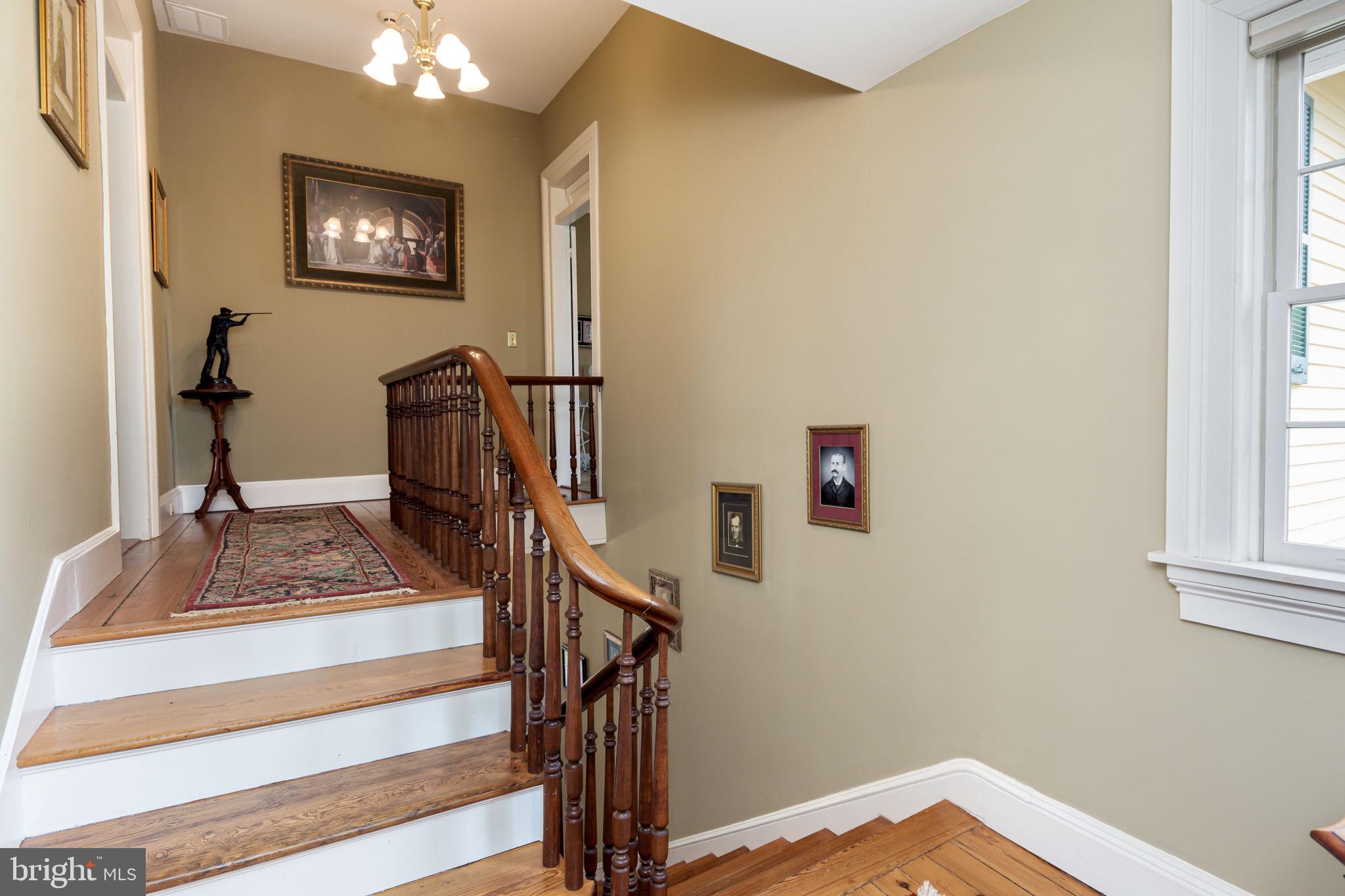 5338 Sudley Road West River, MD 20778 - Photo 24 of 57 2nd floor landing - wood staircase and floors