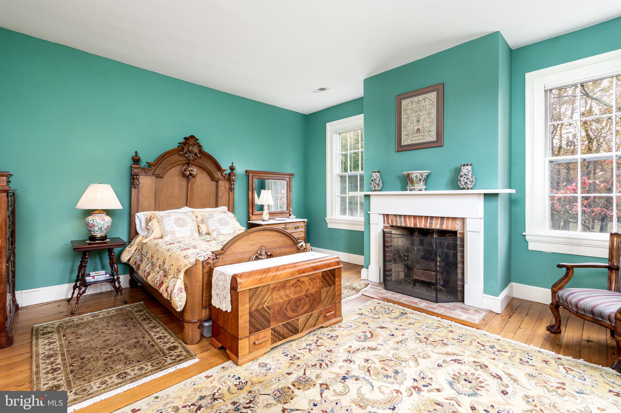 5338 Sudley Road West River, MD 20778 - Photo 28 of 57 Bedroom #2 with fireplace and hardwood floors.