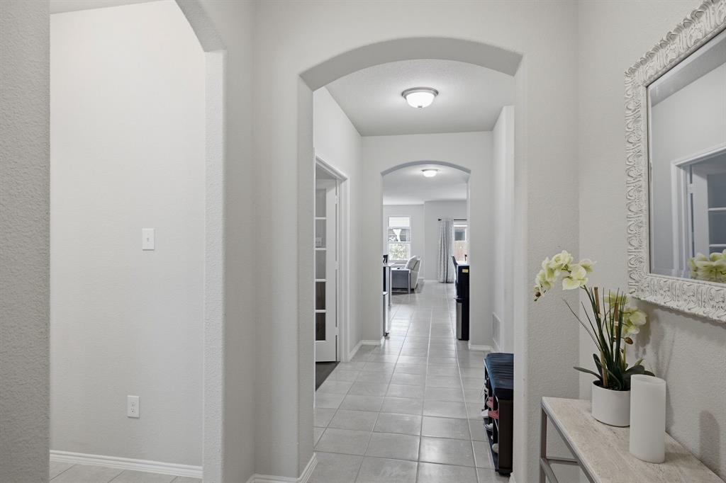 3728 Evergreen Ridge Road Fort Worth, TX 76244 - Photo 6 of 21 Arched entryways featuring light gray wall tones and tile flooring throughout