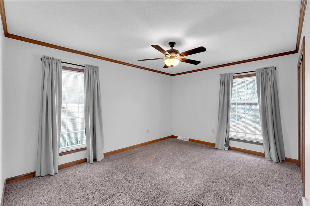 2114 Karen Lane Anderson, SC 29626 - Photo 20 of 30 This spacious bedroom offers ample natural light and a comfortable atmosphere for rest and relaxation.