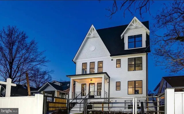 a front view of a house with large windows