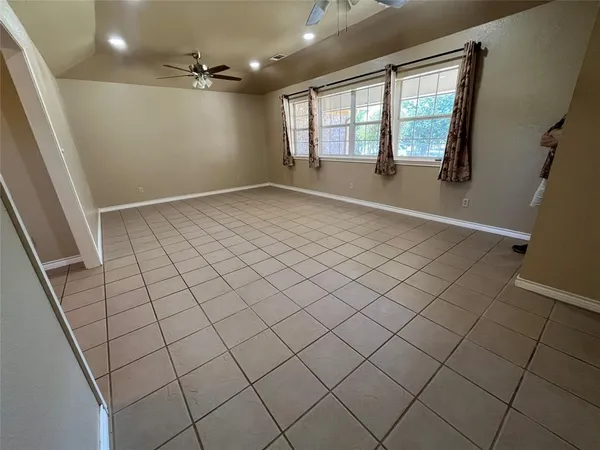 a view of hallway with wooden floor and chandelier