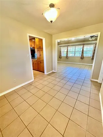 a open kitchen with stainless steel appliances granite countertop a sink and a refrigerator