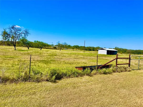 a front view of house with yard and seating area