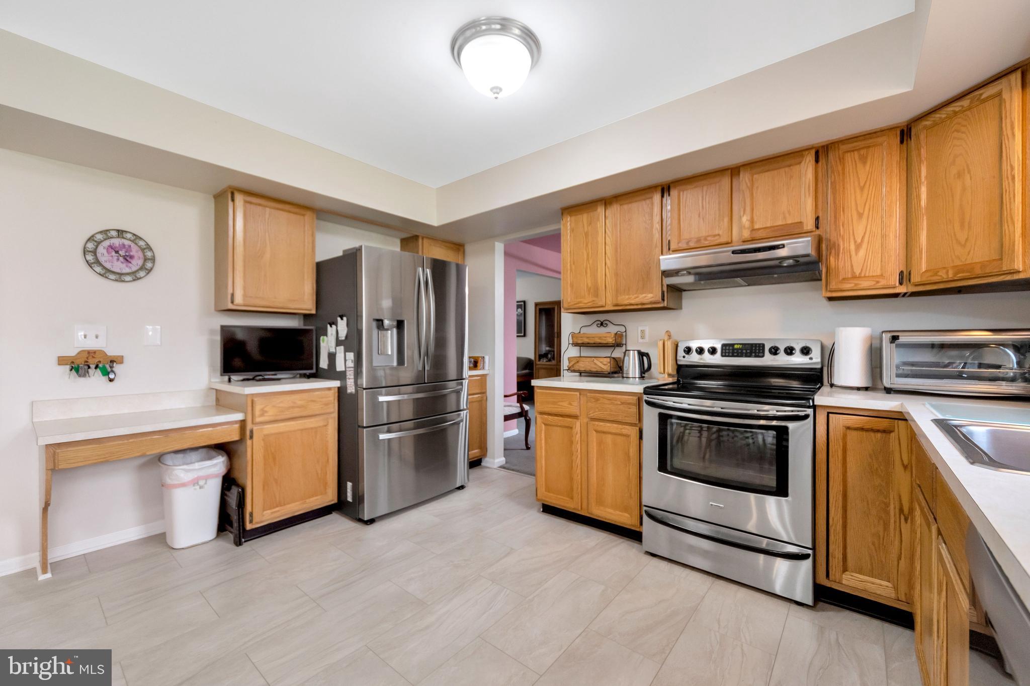 1072 Independence Way Hatfield, PA 19440 - Photo 13 of 37 a kitchen with stainless steel appliances granite countertop a stove a sink and a refrigerator