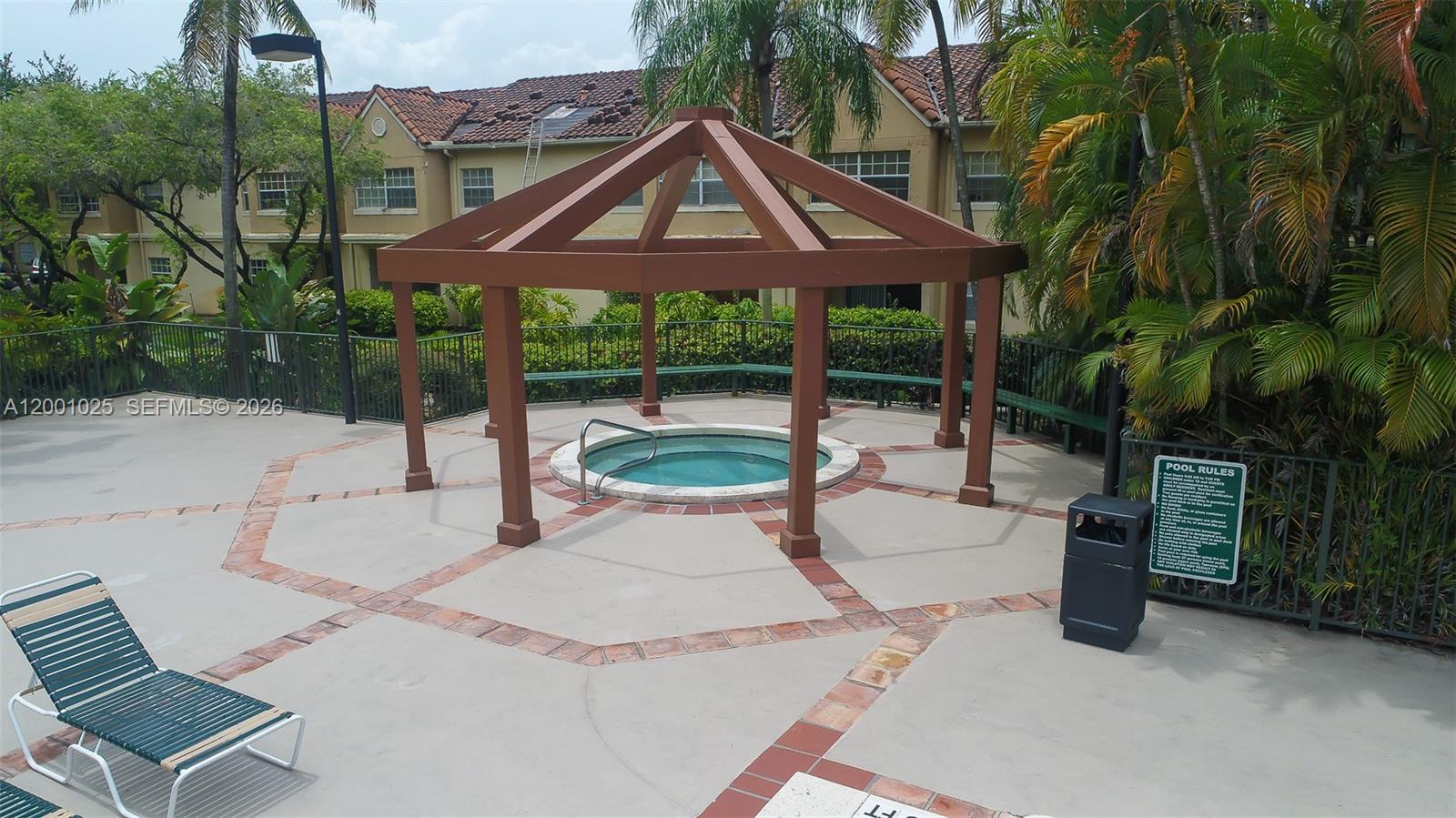 18310 Northwest 68th Avenue, Unit L Hialeah, FL 33015 - Photo 12 of 21 a front view of a house with garden