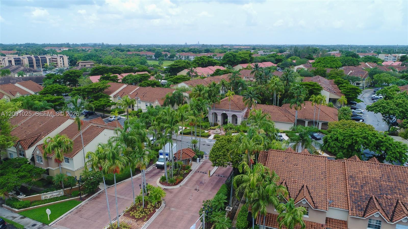 18310 Northwest 68th Avenue, Unit L Hialeah, FL 33015 - Photo 14 of 21 an aerial view of multiple house