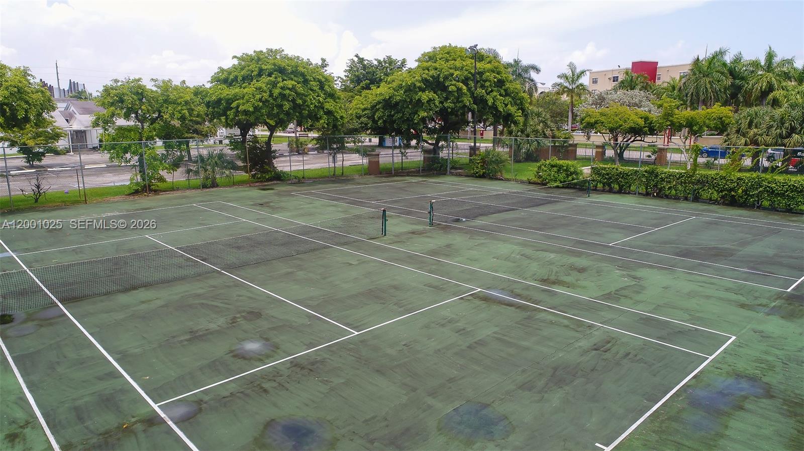 18310 Northwest 68th Avenue, Unit L Hialeah, FL 33015 - Photo 15 of 21 a view of a tennis court