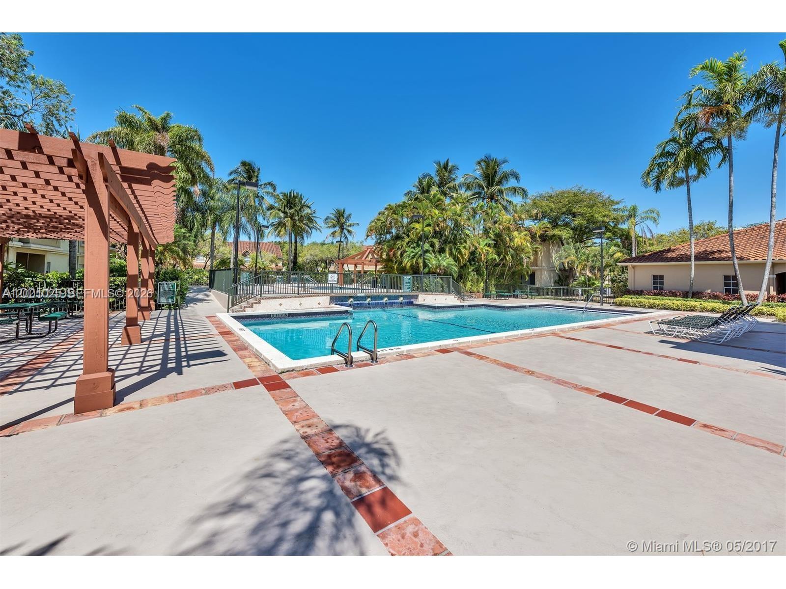 18310 Northwest 68th Avenue, Unit L Hialeah, FL 33015 - Photo 17 of 21 a house with trees in the background