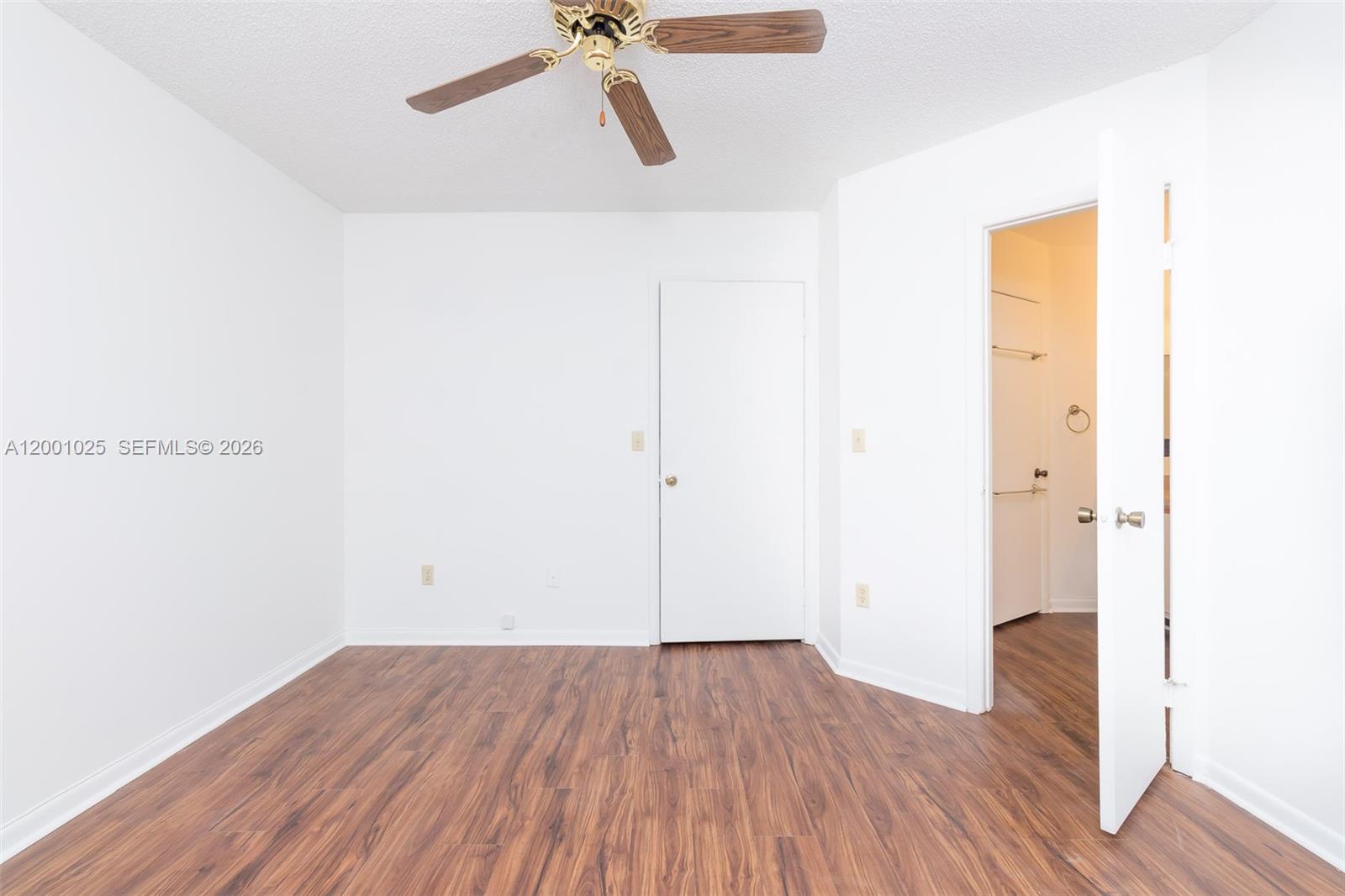 18310 Northwest 68th Avenue, Unit L Hialeah, FL 33015 - Photo 7 of 21 a view of a room with wooden floor