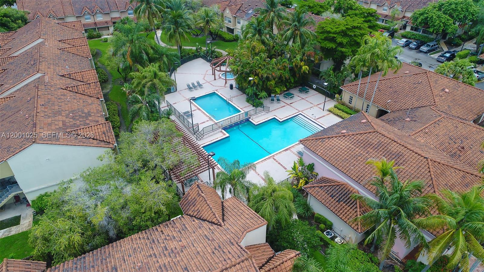 18310 Northwest 68th Avenue, Unit L Hialeah, FL 33015 - Photo 9 of 21 an aerial view of a house with outdoor space and street view
