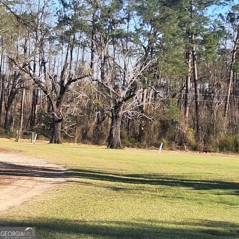 a view of swimming pool with an outdoor space and seating area