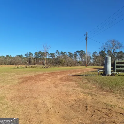 a view of lake with green space