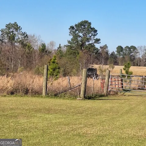 a view of a lake with houses in the back