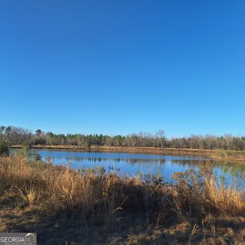 a view of a large body of water with a building in the background