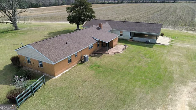 a view of a wooden house with a yard