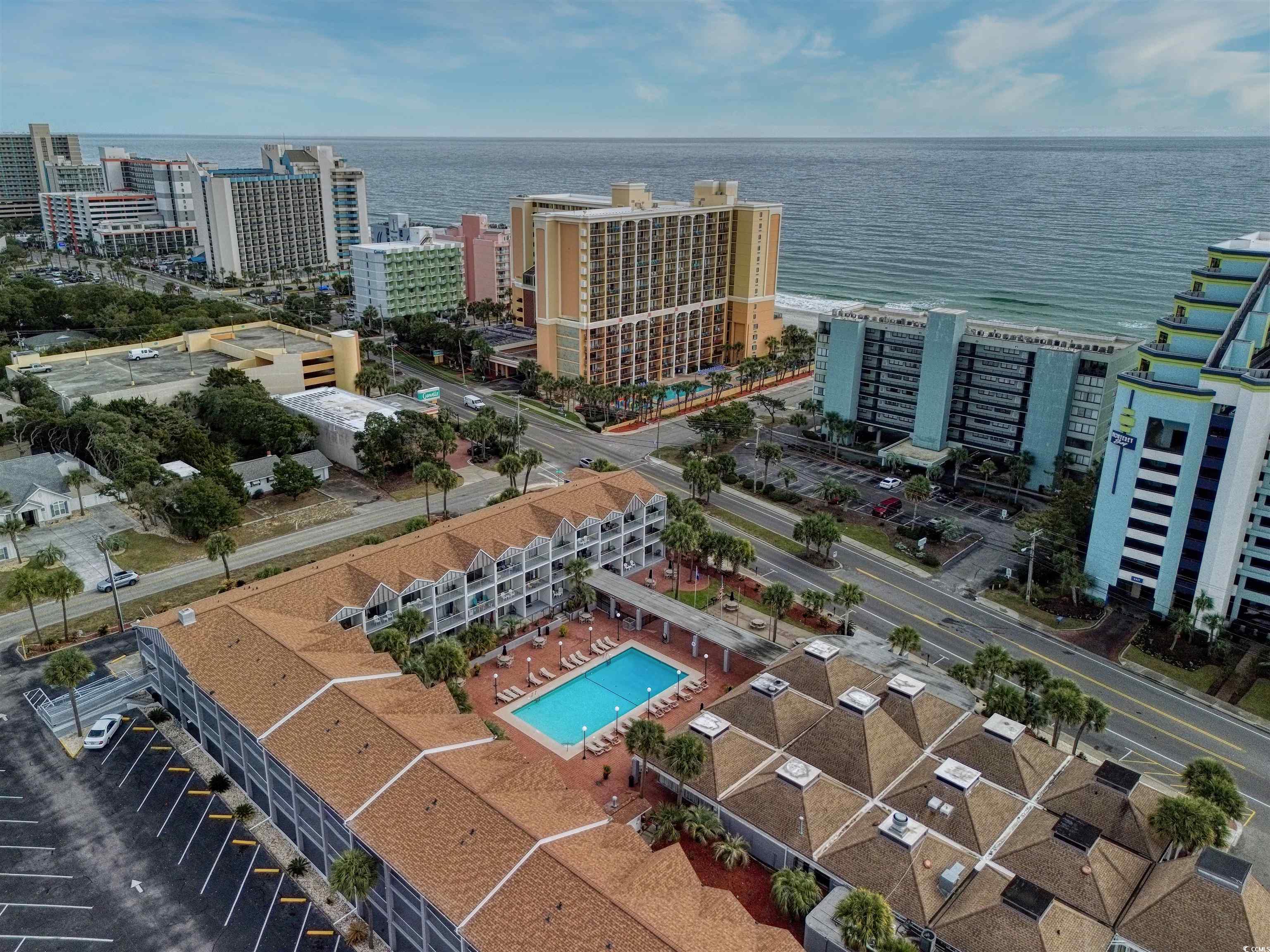 6803 North Ocean Boulevard, Unit 314 Myrtle Beach, SC 29572 - Photo 16 of 19 View of urban area with a pool area and a nearby body of water