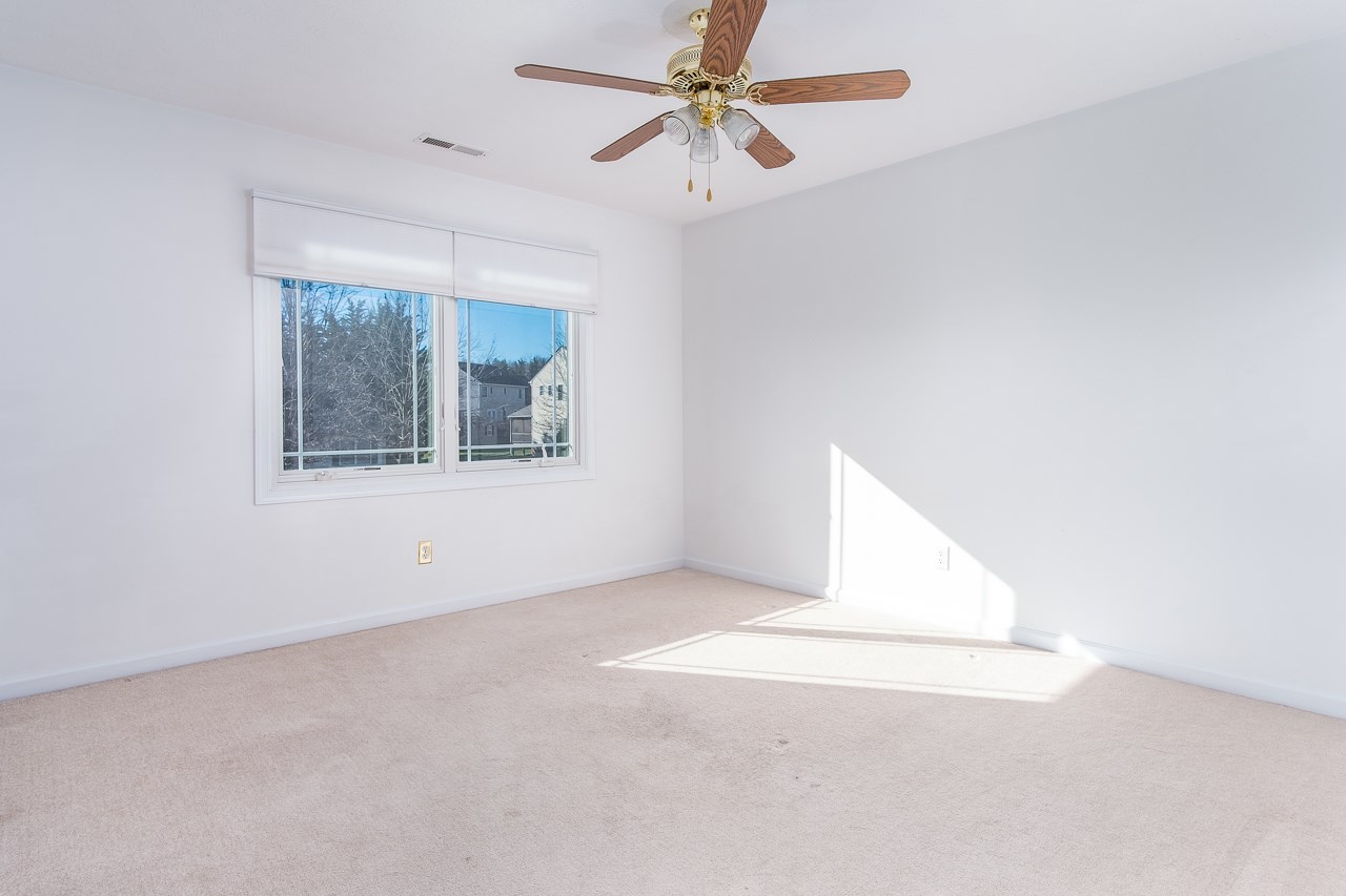 15 Long Bow Road Waynesboro, VA 22980 - Photo 34 of 47 an empty room with a window and a ceiling fan