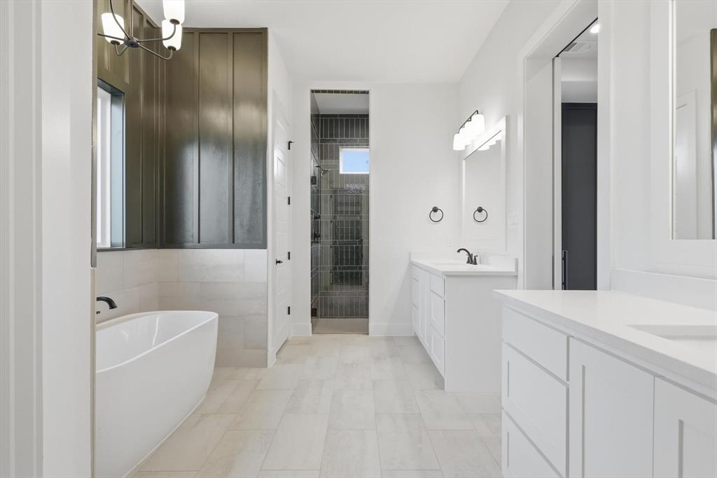 6412 Rigel Road Godley, TX 76044 - Photo 25 of 38 a bathroom with a bathtub and a shower