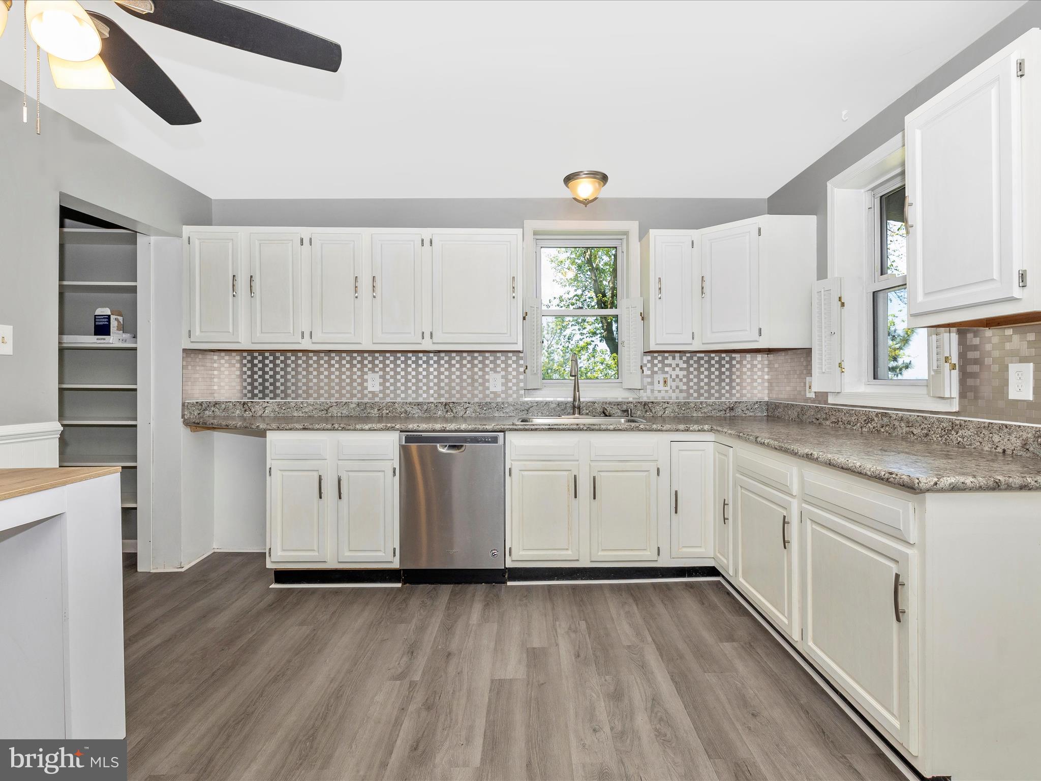 6330 Clevelandtown Road Boonsboro, MD 21713 - Photo 13 of 56 a kitchen with granite countertop white cabinets and white appliances