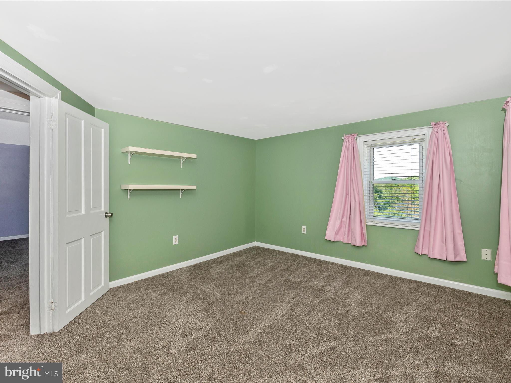 6330 Clevelandtown Road Boonsboro, MD 21713 - Photo 28 of 56 an empty room with closet and windows