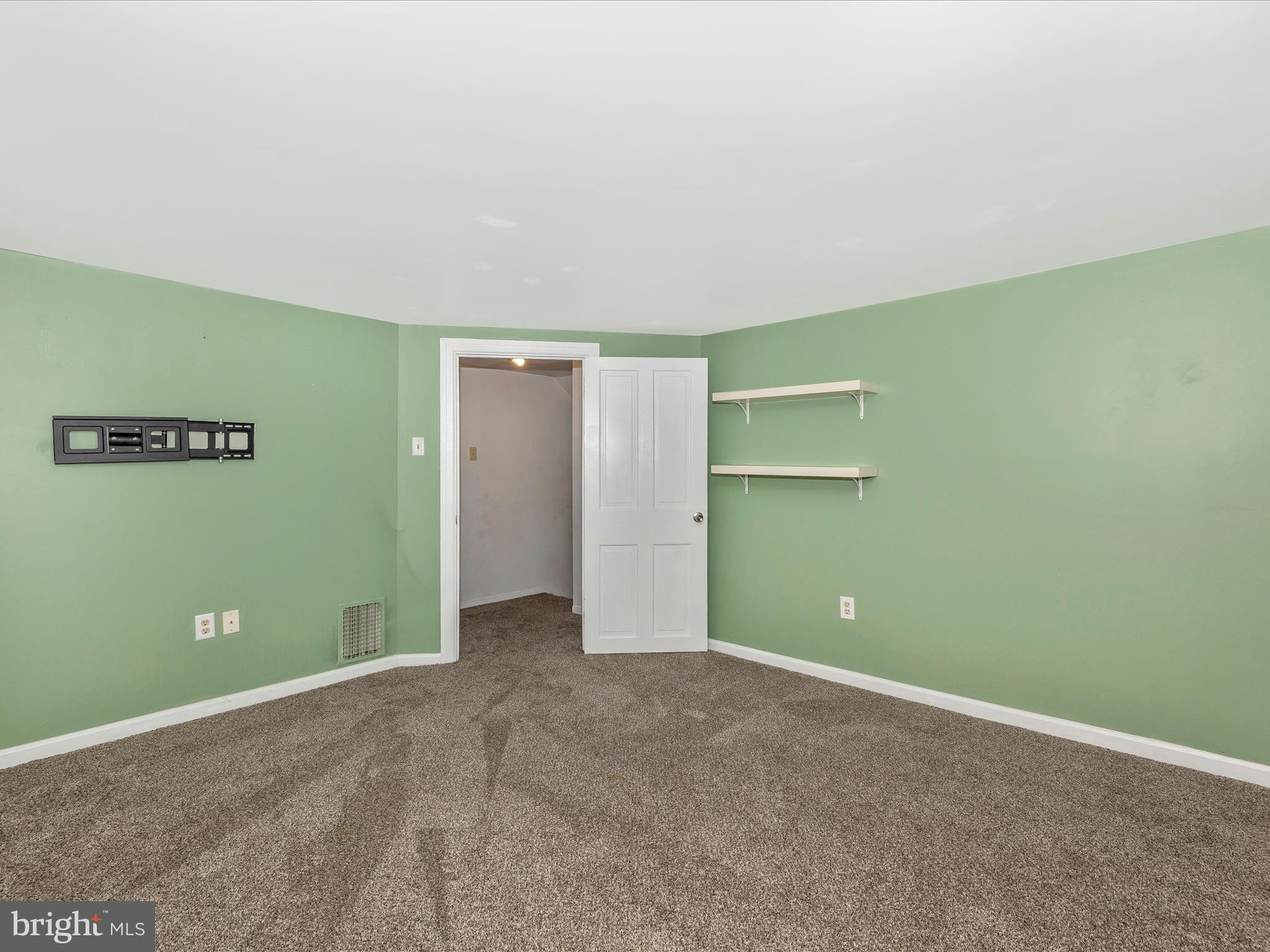 6330 Clevelandtown Road Boonsboro, MD 21713 - Photo 29 of 56 a view of an empty room with a fireplace and wooden floor