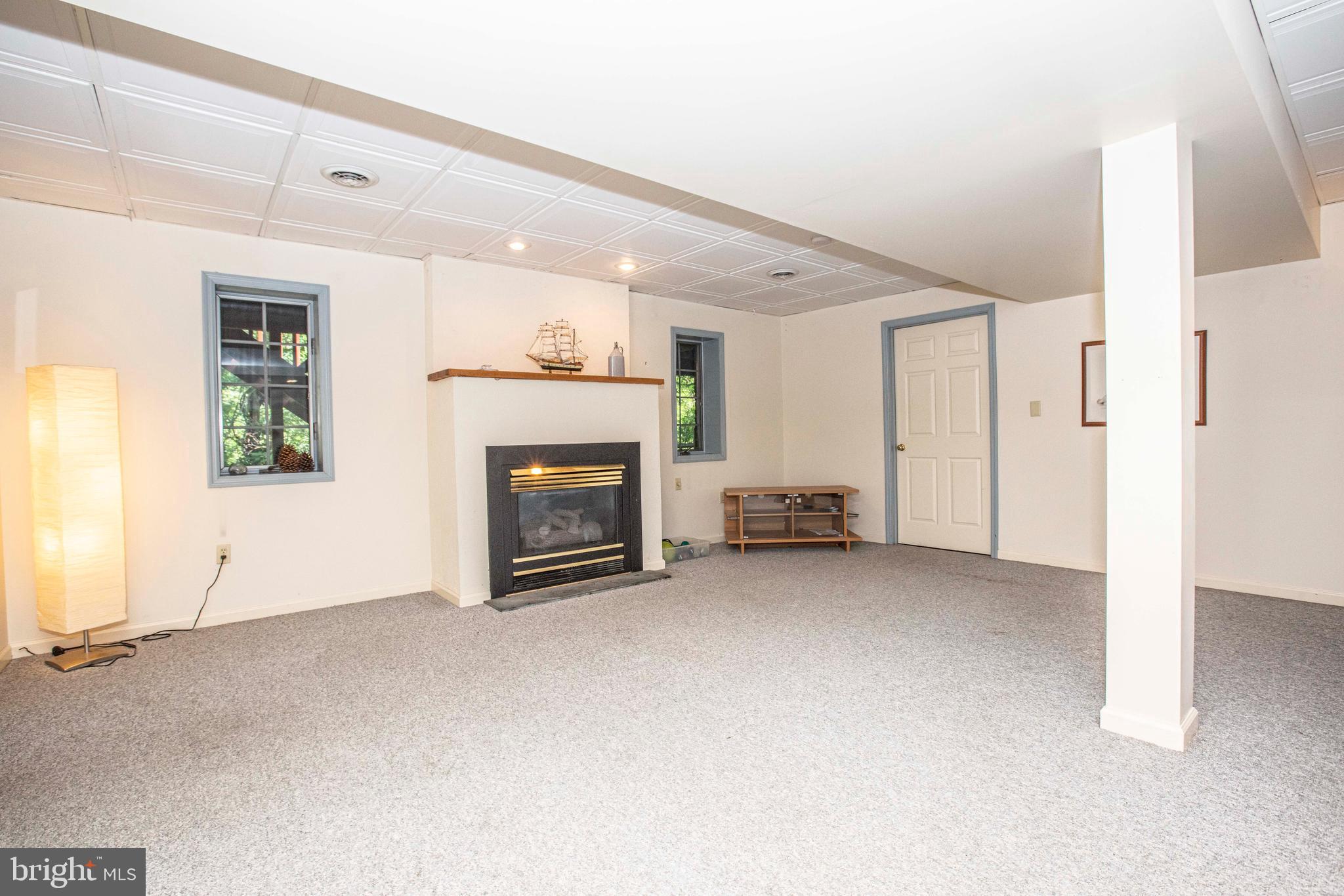 6 Sandy Way Reading, PA 19607 - Photo 53 of 76 Finished basement family room with fire place.
