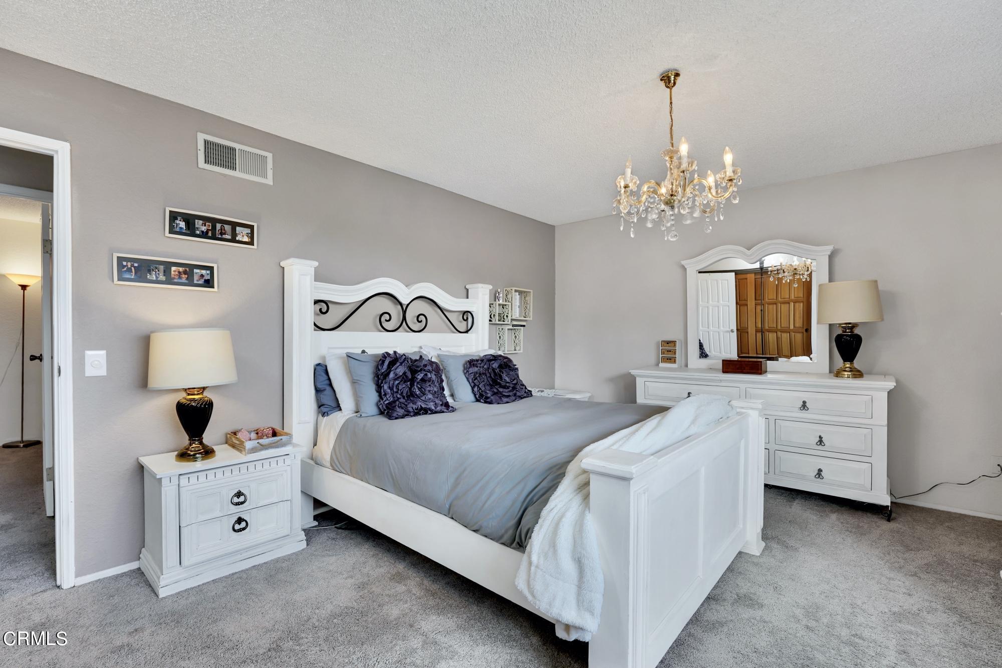 3405 Brookridge Road Duarte, CA 91010 - Photo 22 of 40 a spacious bedroom with a bed and a dresser