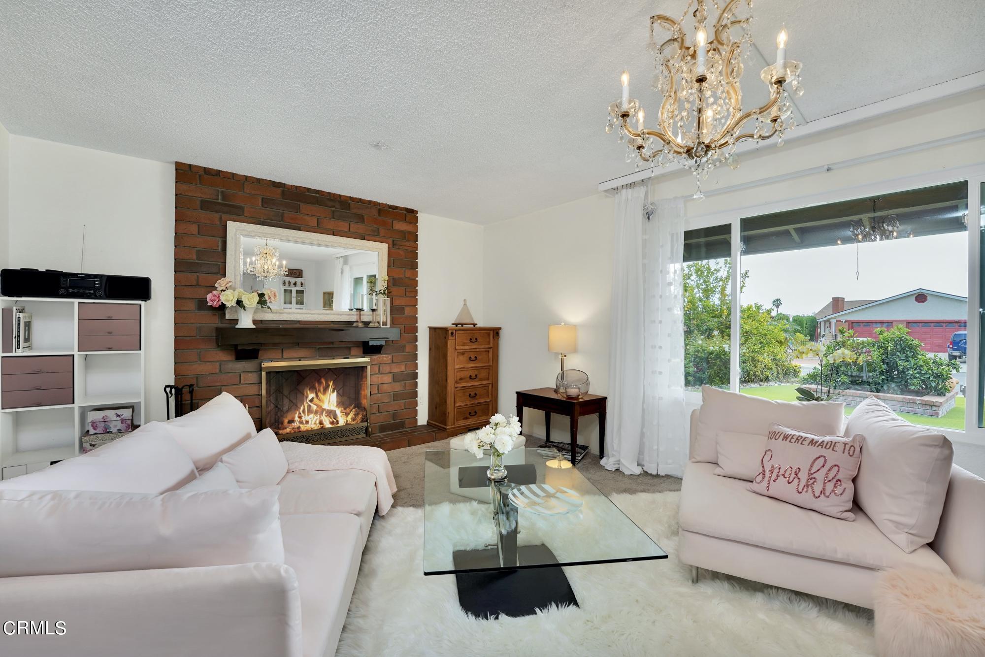 3405 Brookridge Road Duarte, CA 91010 - Photo 8 of 40 a living room with furniture a fireplace and a large window
