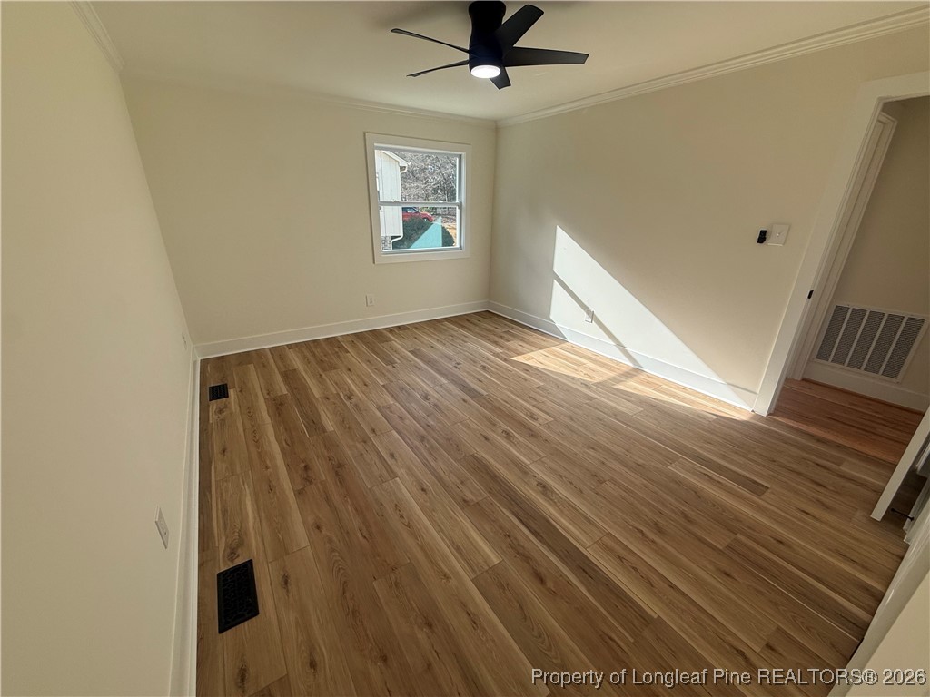 5508 Sweetbriar Drive Raleigh, NC 27609 - Photo 15 of 29 a view of empty room with wooden floor