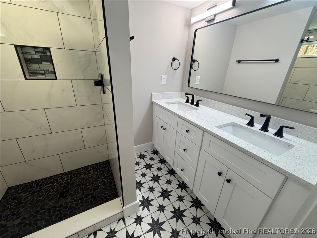 5508 Sweetbriar Drive Raleigh, NC 27609 - Photo 21 of 29 a bathroom with a sink and a mirror