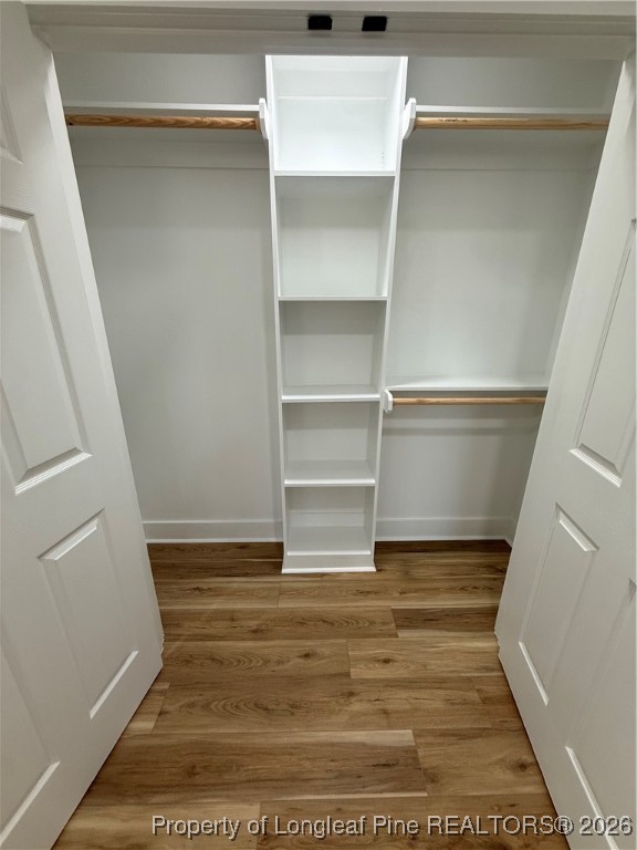 5508 Sweetbriar Drive Raleigh, NC 27609 - Photo 22 of 29 a view of walk in closet with empty racks