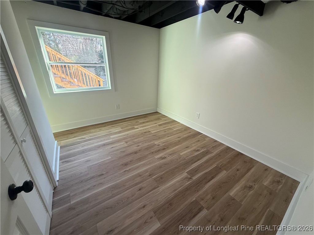 5508 Sweetbriar Drive Raleigh, NC 27609 - Photo 28 of 29 an empty room with windows
