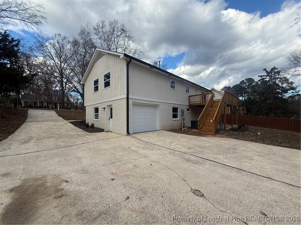 5508 Sweetbriar Drive Raleigh, NC 27609 - Photo 4 of 29 a view of garage with wooden fence