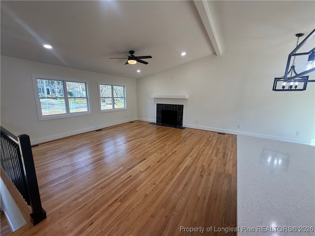 5508 Sweetbriar Drive Raleigh, NC 27609 - Photo 7 of 29 wooden floor in an empty room with a window