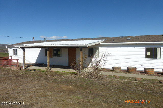 201 Mini Pines Road Yakima, WA 98903 - Photo 1 of 11 a view of house with backyard